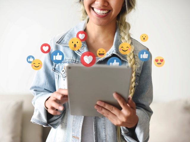 Cheerful woman watching a live video